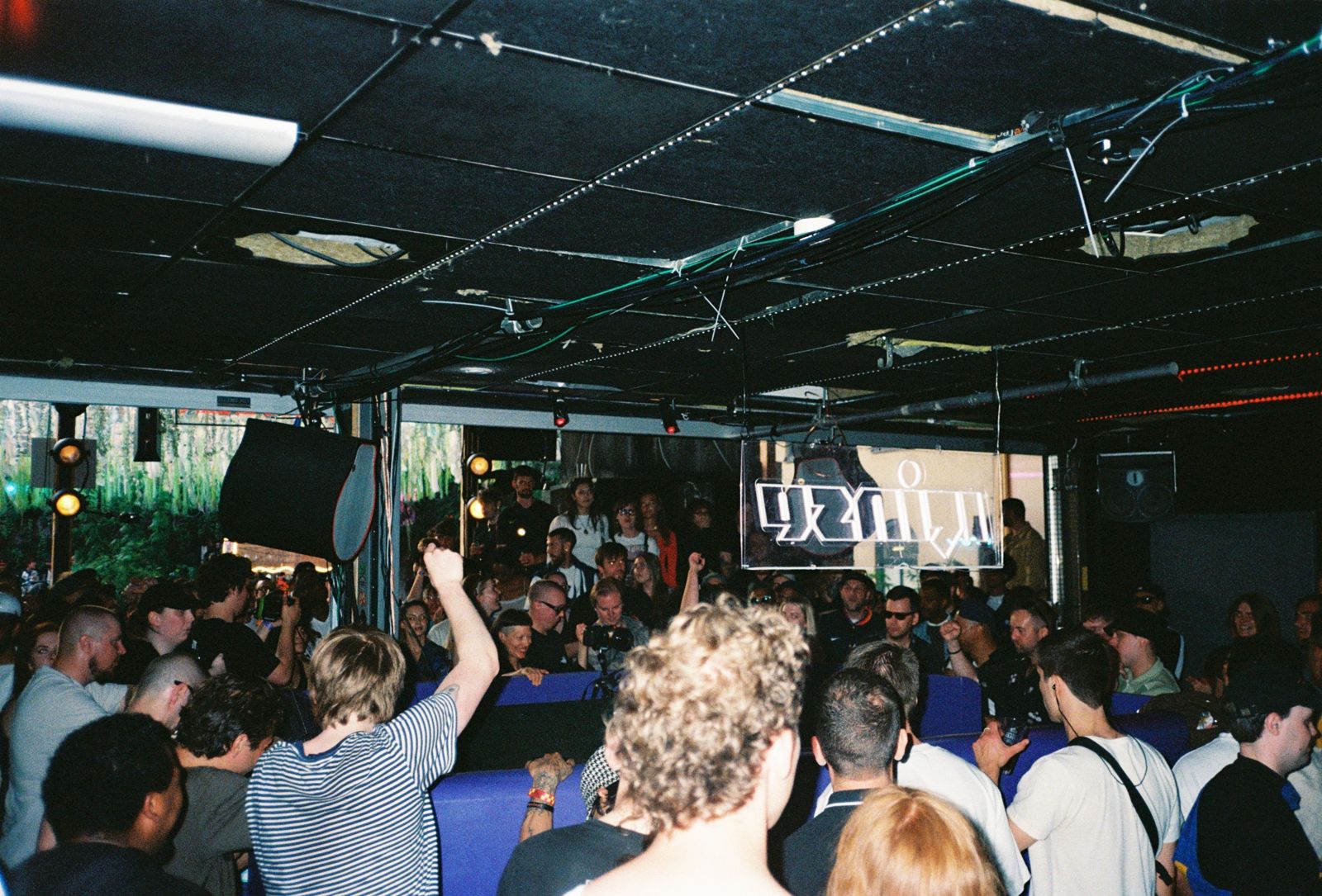 The packed room seen from the back